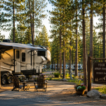 Fifth-wheel RV parked at a spacious seasonal site surrounded by tall ponderosa pines at Heber RV Resort in Heber-Overgaard, Arizona.